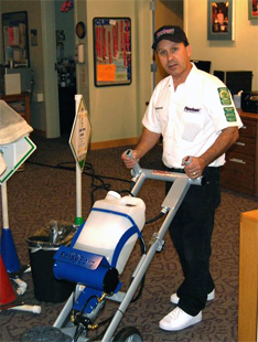 Raymond Romero cleaning carpet